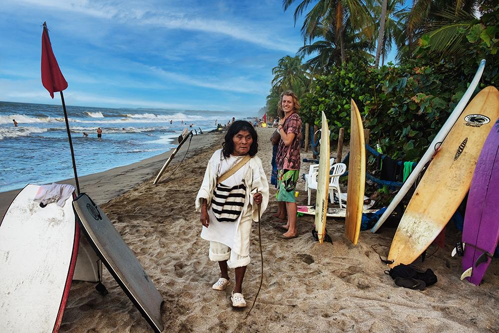 Kogi Man and Surfer - Palomino, Colombia